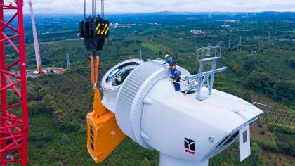 Workers at a wind turbine construction site.